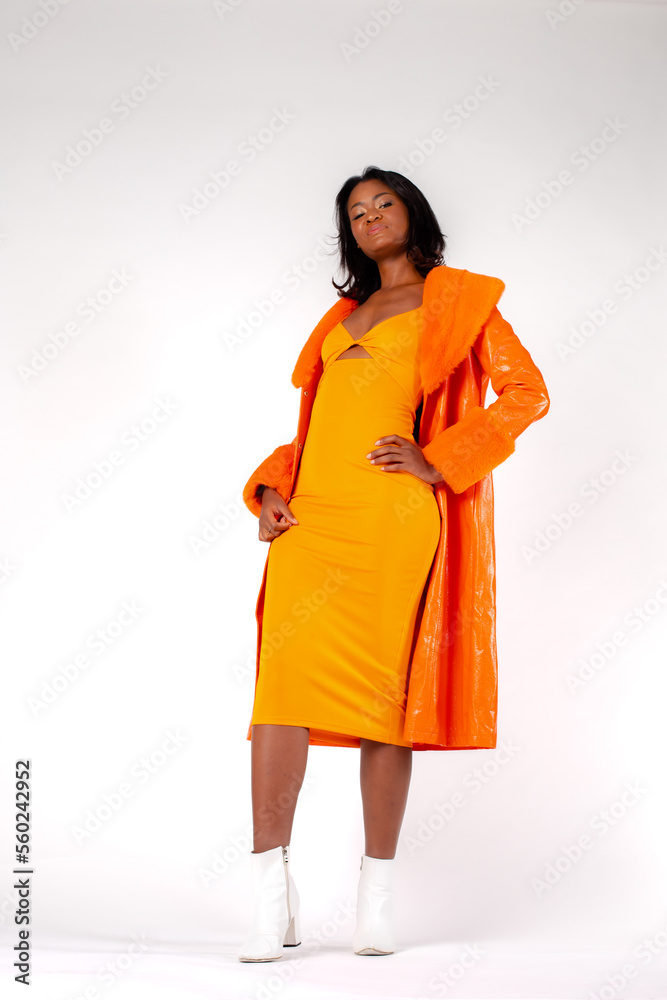 Trendy ethnic female touching waist and neck Trendy ethnic female touching waist and neck