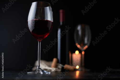 glass of red wine on a dark background. wineglass