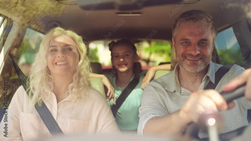 Portrait of happy family getting ready for a car trip, beginning of vacation