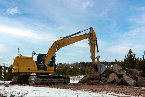 Crawler excavator working on the demolition of a building