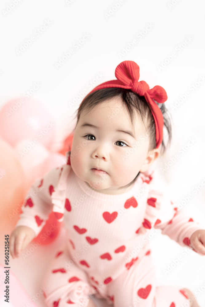 baby with valentine's heart shaped balloons baby with valentine's heart shaped balloons