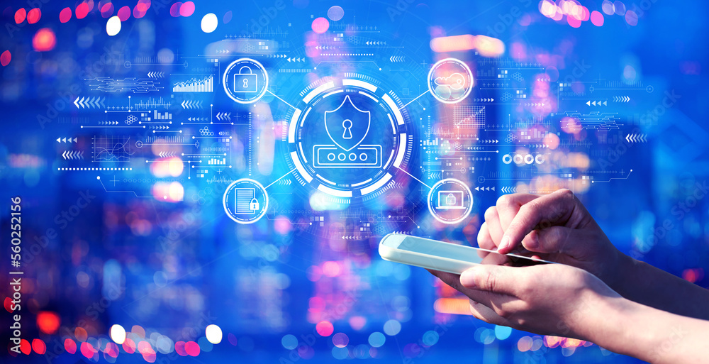 Cyber security theme with person using a smartphone in a city at night Cyber security theme with person using a smartphone in a city at night