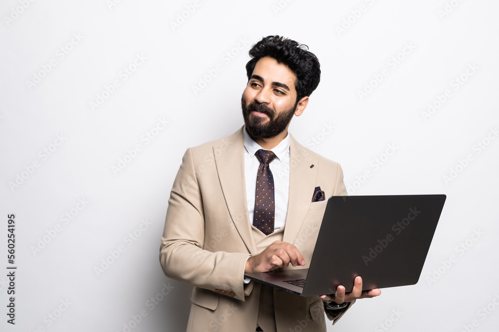 Successful arab young man student freelancer using laptop, watching webinars, working remotely, e-learning e-commerce online isolated in white background Successful arab young man student freelancer using laptop, watching webinars, working remotely, e-learning e-commerce online isolated in white background