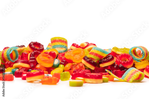 Assorted colorful gummy candies. Top view. Jelly donuts. Jelly bears. Isolated on a white background.