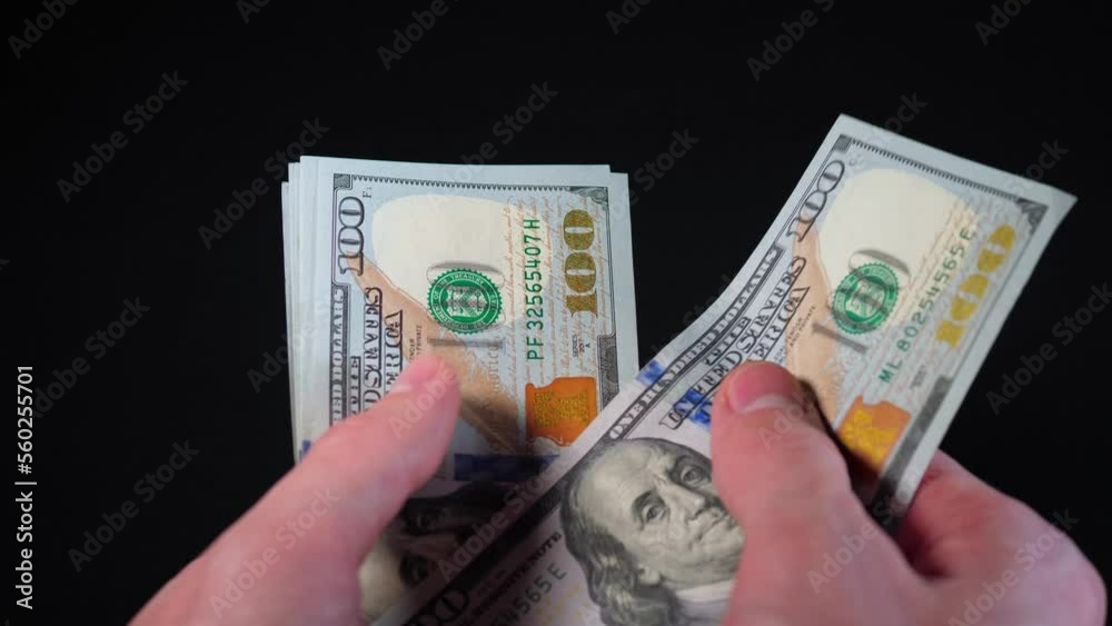 man counts hundred-dollar bills. Counting money close-up 4k video. Paper money purchase, payment, wealth, investment man counts hundred-dollar bills. Counting money close-up 4k video. Paper money purchase, payment, wealth, investment
