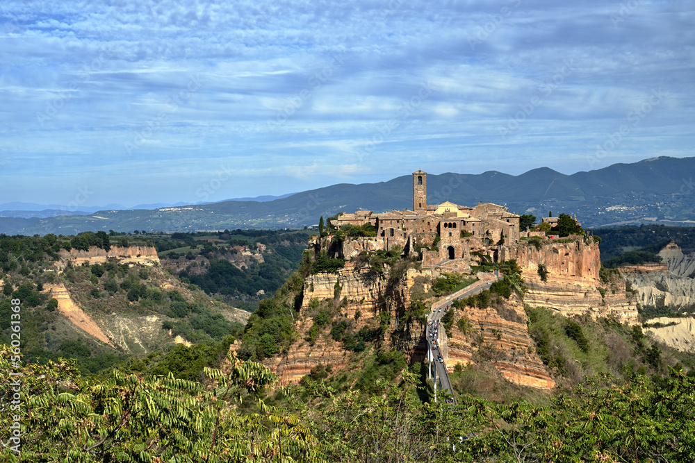 the historic stone town of Bagnoregio at the top of the rock with concrete footbridge