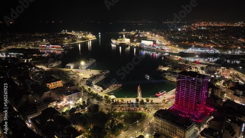 Aerial drone night video of famous illuminated port of Piraeus one of the largest in Europe during New Year's eve, Attica, Greece photo