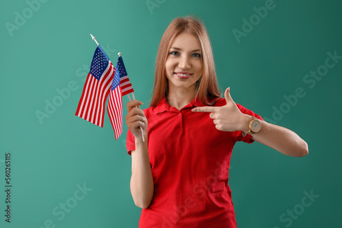 Young redhead woman pointin...