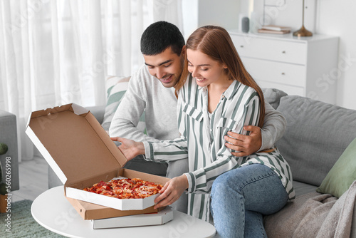 Happy young couple eating t...