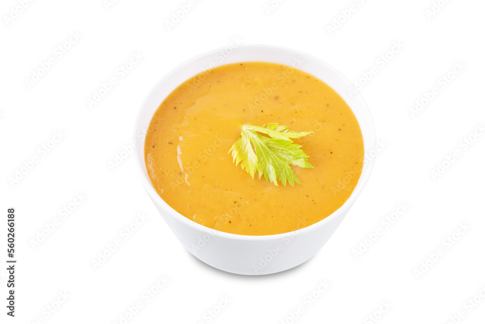 Celery carrot puree soup in a bowl on a white isolated background Celery carrot puree soup in a bowl on a white isolated background
