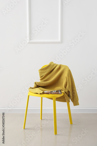 Chair with yellow sweater a...
