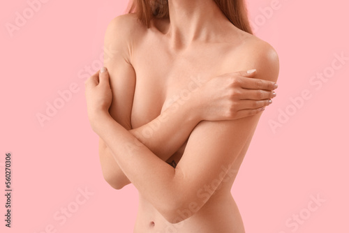 Billede på lærred Naked young woman on pink background