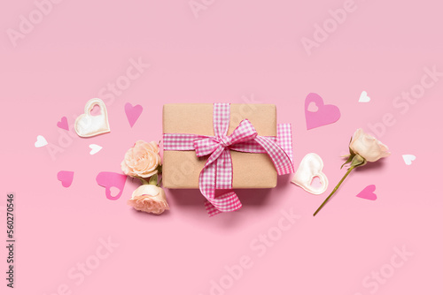 Gift box with roses and hearts for Valentine's Day on pink background © Pixel-Shot