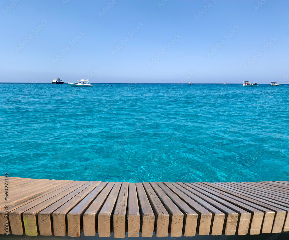 Naklejka premium Background of parallel boards on the background of the seascape