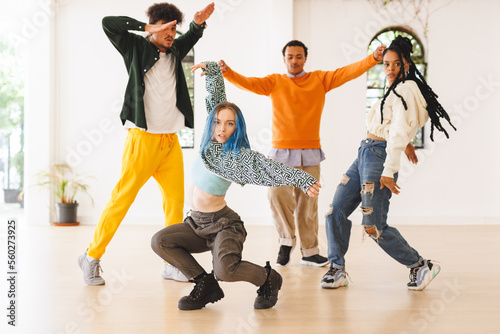 Image of diverse female and male hip hop dancers during training in dance club