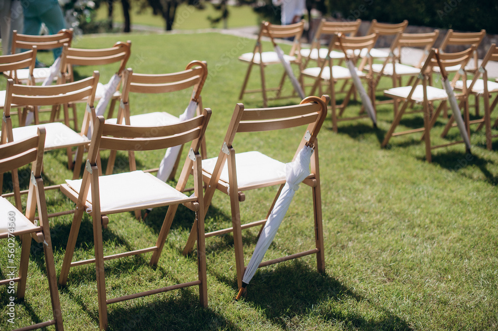 wedding ceremony arch with empty chairs and flowers. beautiful romantic decoration wedding ceremony arch with empty chairs and flowers. beautiful romantic decoration
