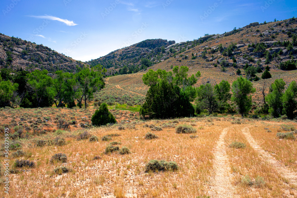 landscape of Granite Mountains, Wyoming, Fremont county with sagebrush, thin prairie grass with fractured granite mountains