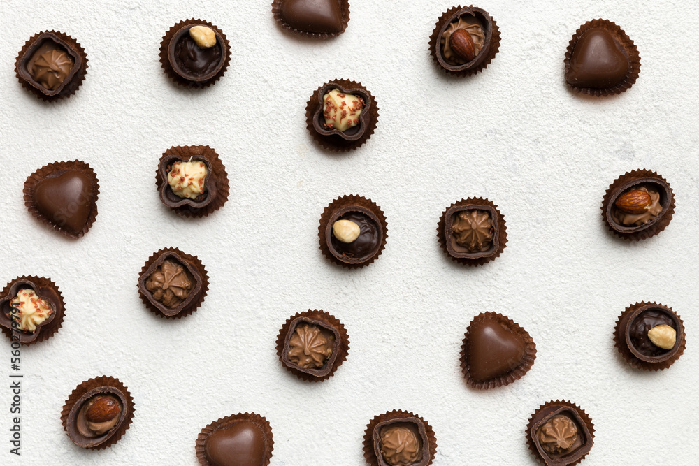 Different kinds of chocolates on colored table close-up. Top View and Flat Lay