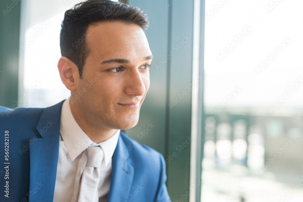 Man looking out of a window