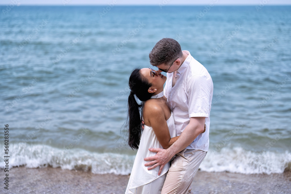 Love couple on holiday happy playing running along the beach and sweet kiss on love emotion Love couple on holiday happy playing running along the beach and sweet kiss on love emotion