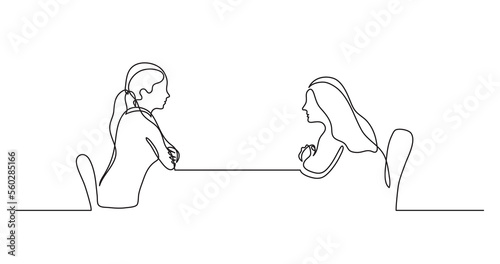 two young women sitting behind table talking - PNG image with transparent background