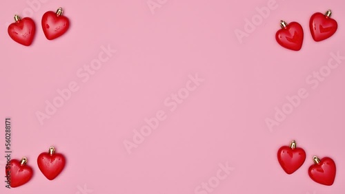 Wallpaper Mural Valentine's day background with hearts appear and copy space on pastel pink background. Stop motion. Flat lay Torontodigital.ca