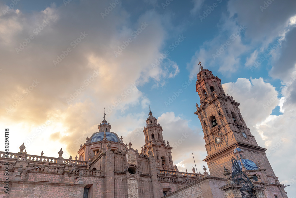 Morelia Cathedral in the state of Michoacan, Mexico at sunset with cloudy sky