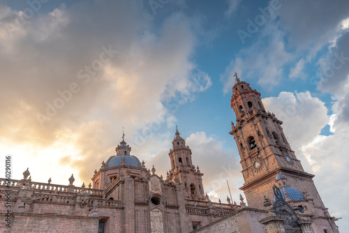 Morelia Cathedral in the state of Michoacan, Mexico at sunset with cloudy sky