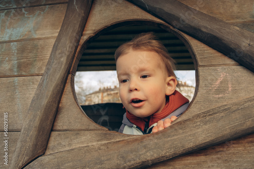 portrait of a blonde brown-eyed child on the playground