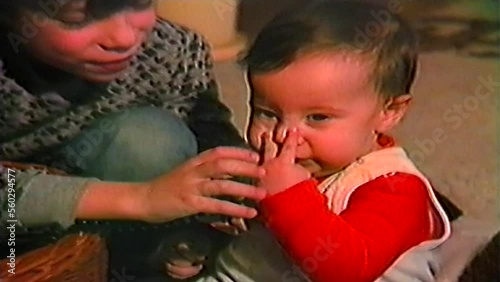 Two little brothers playing with toys,family retro home video