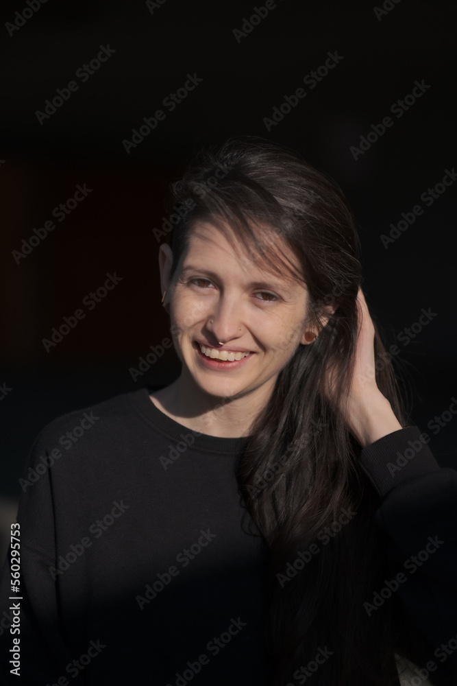 A model (they/them, White) smiling and laughing. A model (they/them, White) smiling and laughing.