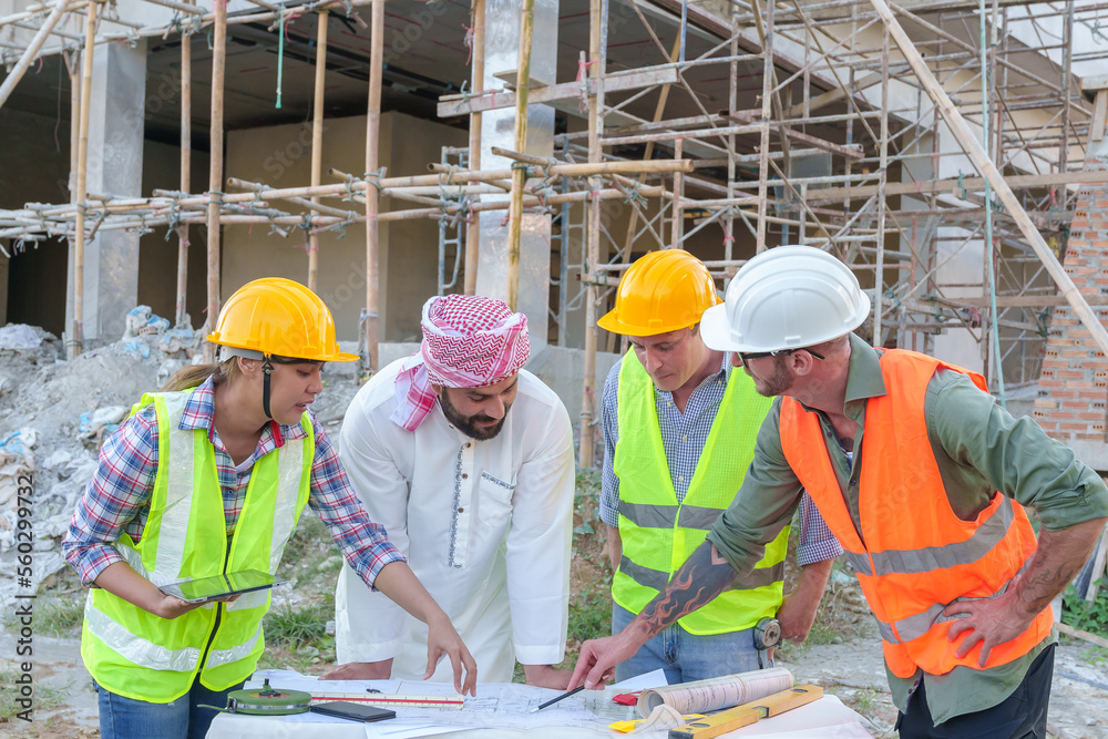 custom made wallpaper toronto digitalDiverse team of professionals using tablet computers on construction site. Real estate construction project. with civil engineers, architects, Arabic business investors and explorer with theodolite