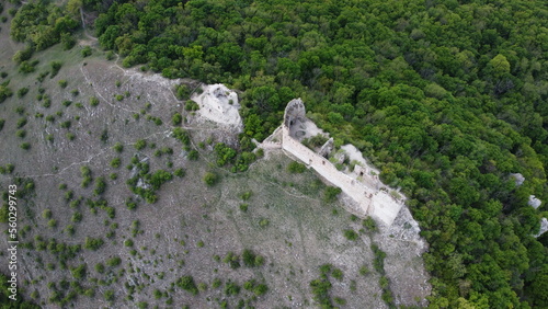 Devicky castle ruins, Burgruine Maidenburg a ruined 1200s fortress on a rocky crag aerial panorama landscape view in Palava mountain range,South Moravian region of Czech republic photo