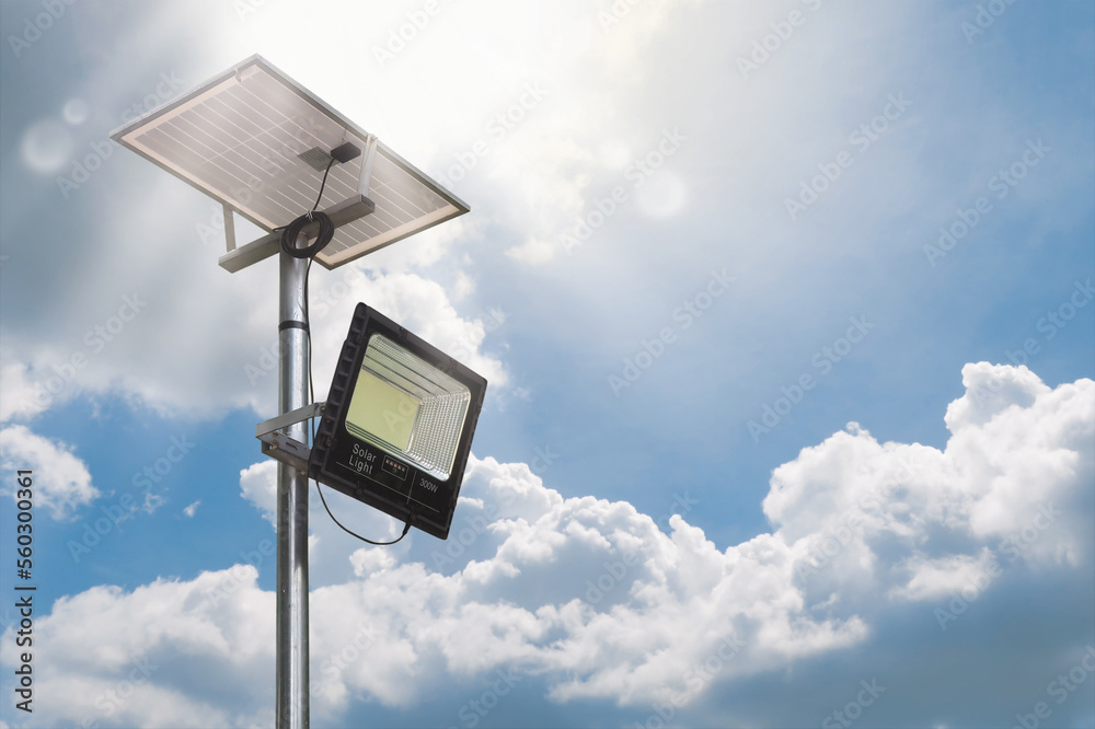 Parking LED lamp with solar panel electric eco energy with sky light beam background Parking LED lamp with solar panel electric eco energy with sky light beam background
