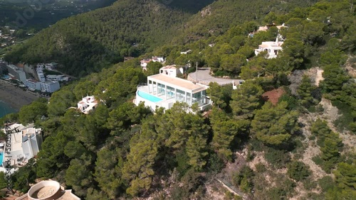 Luxury finca with pool. Calm aerial view flight panorama orbit drone
island ibiza villa Cala de Sant Vicent, autumn 2022. High Quality 4k Cinematic footage photo