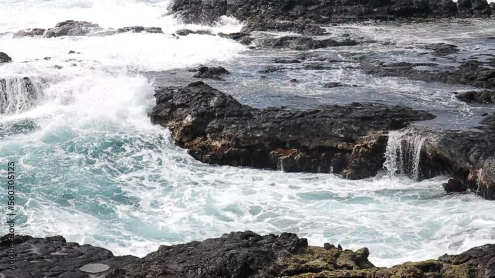 Waves Crash Against Rocky Shore in Hawaii Waves Crash Against Rocky Shore in Hawaii