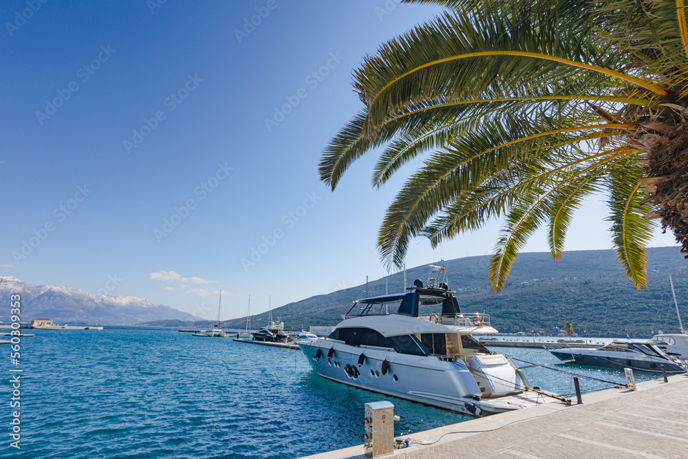 Yachts under blue sky moored in the protected bay of the Adriatics.