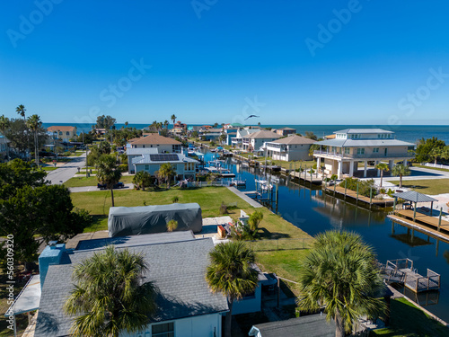 Obraz na plátne Seaside houses and buildings in a gulf of mexico canal in Florida from drone