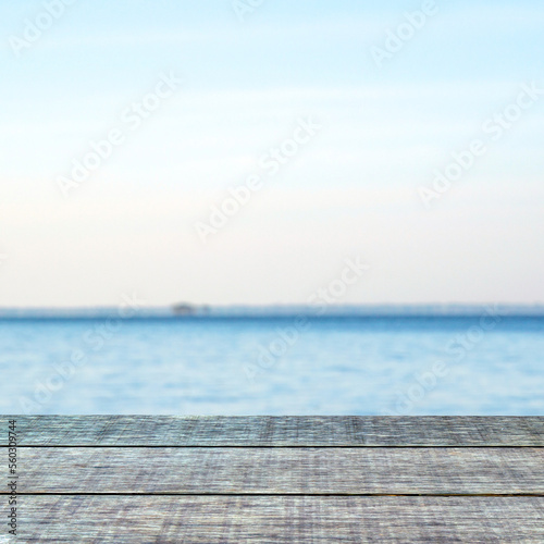 Old wooden table with blurred lake background harbor product presentation background design template