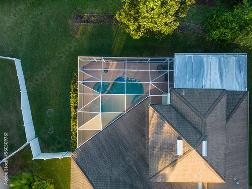 Pool screen enclosure of Tampa Bay Florida Home in Neighborhood from Aerial Drone
