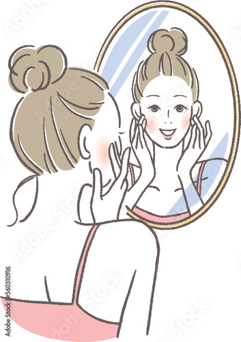鏡を見て微笑む女性