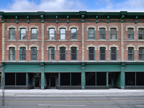 Row of old main street buildings with stores at ground level and apartments or offices above