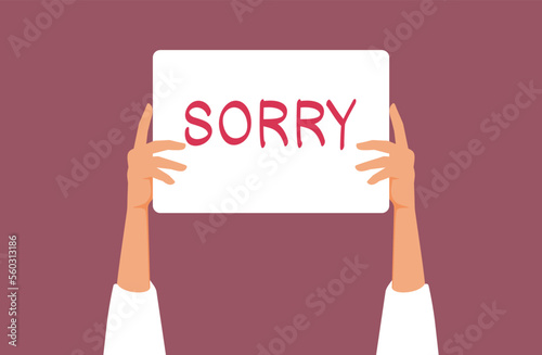 Hand Holding a Sorry Apology Sign Vector Cartoon Illustration. Repentant person feeling ashamed begging for forgiveness 
