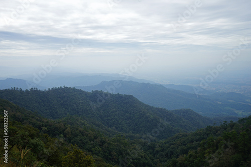 Natural landscape of green mountain range with cloudy blue sky © chettarin