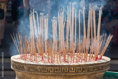 Incense stick are burning in an incense pot. photo