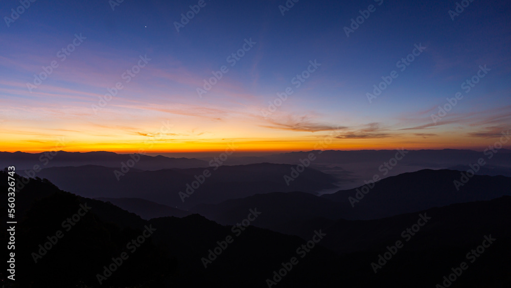 Night sky with moon before sunset on mountain at .Doi Phu Kha of Thailand for background.