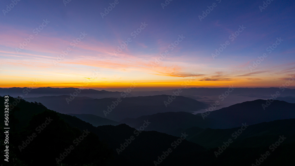 Night sky with moon before sunset on mountain at .Doi Phu Kha of Thailand for background.