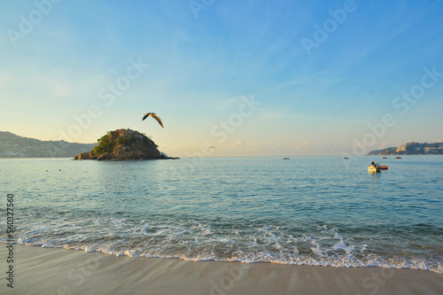 Fototapeta Naklejka Na Ścianę i Meble -  Sunrise in Acapulco beach, Condesa beach, beach and calm sea in Mexico