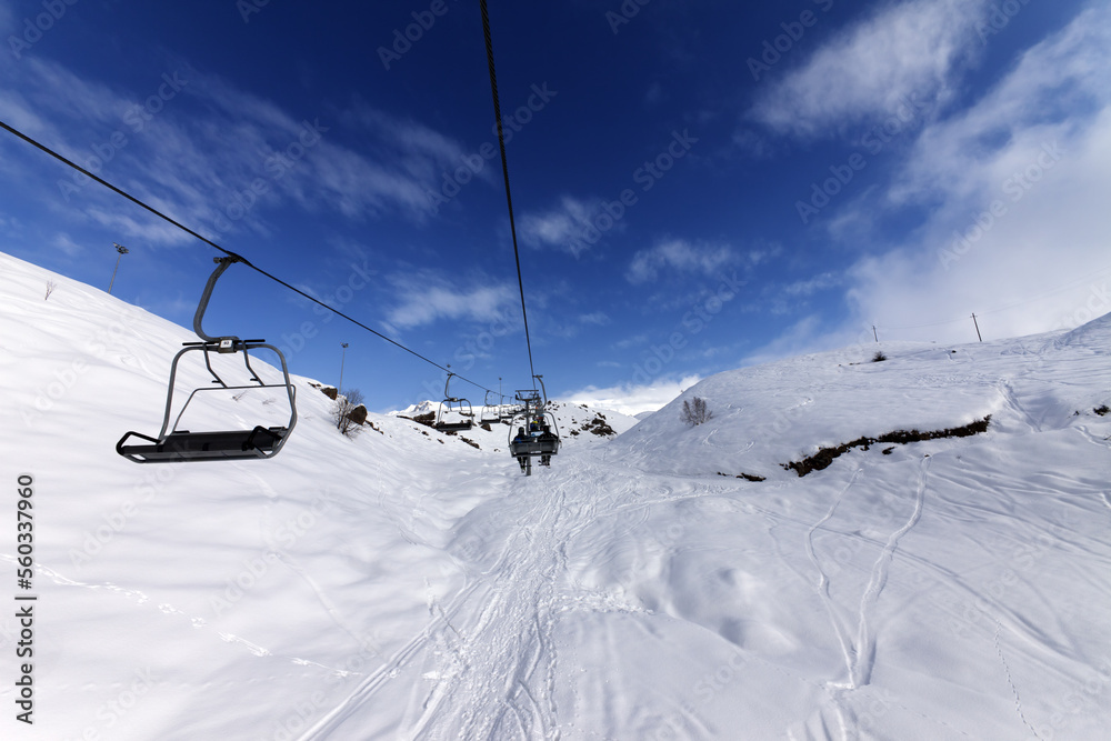Chair-lift at ski resort Chair-lift at ski resort