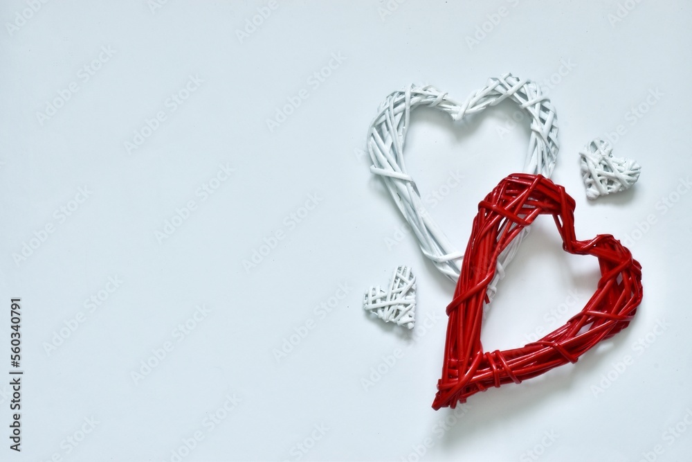 Composition from various hearts. Valentine's Day concept with red and white hearts on white background. Flat lay, copy space. Composition from various hearts. Valentine's Day concept with red and white hearts on white background. Flat lay, copy space.